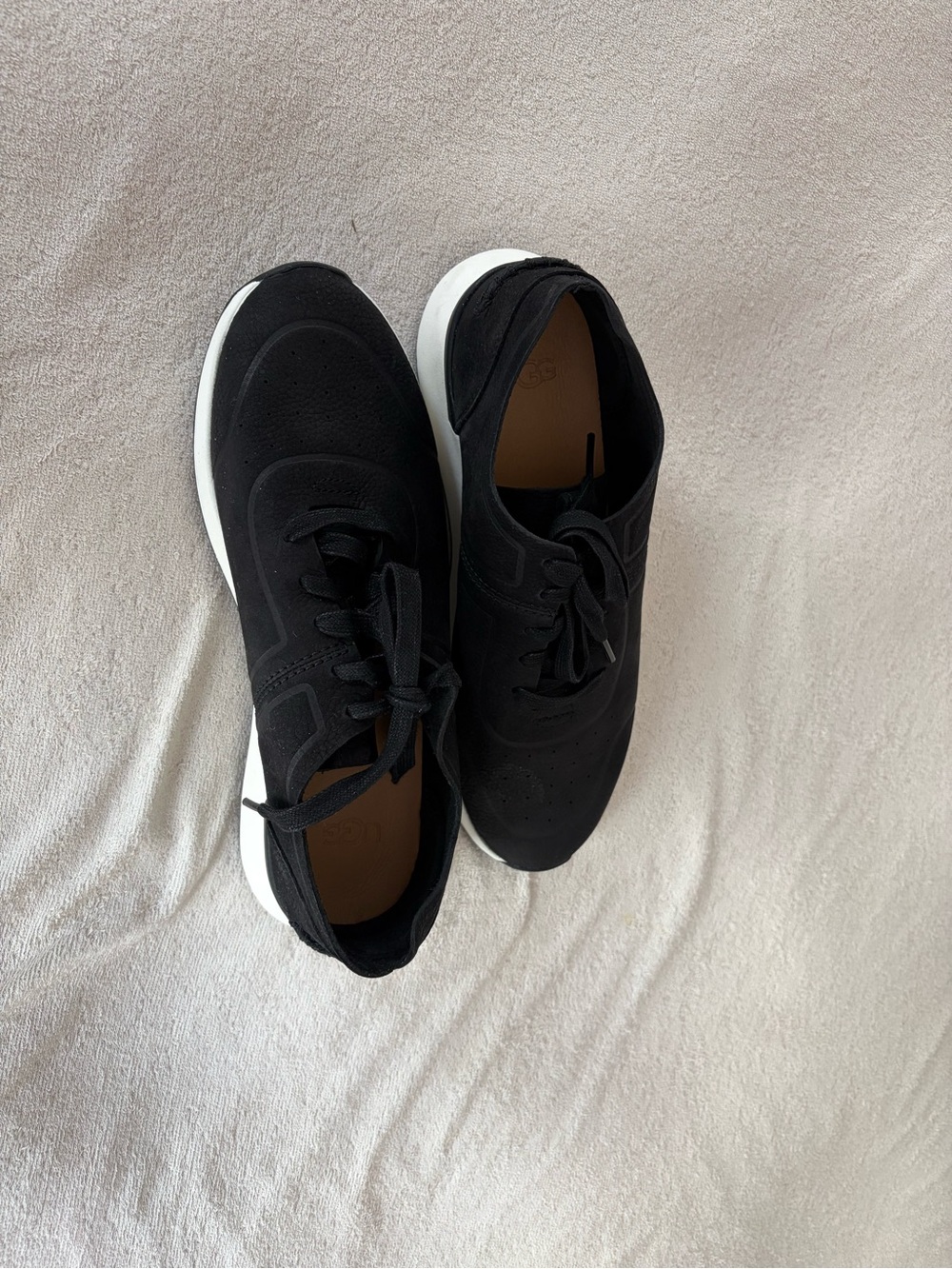 Women’s black UGG sneakers